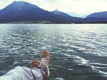 Scenic view of lake with mountains in background