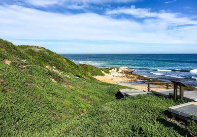 Scenic view of sea against cloudy sky