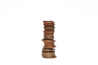 Stacked coins against white background