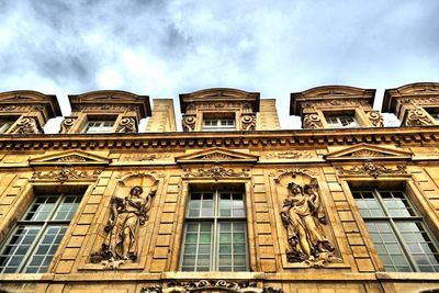 Low angle view of statue against cloudy sky