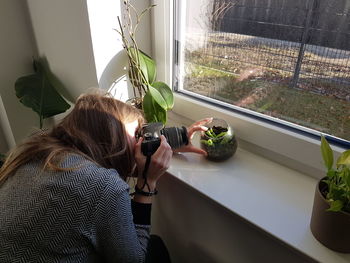 Woman photographing venus flytraps