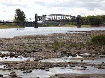 Bridge over river against sky