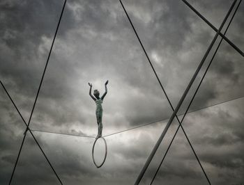 Low angle view of statue against sky