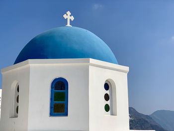 Low angle view of white building against blue sky