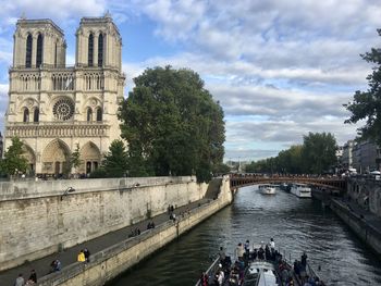 View of bridge over river with buildings in background