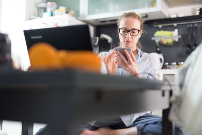 Portrait of man working on table