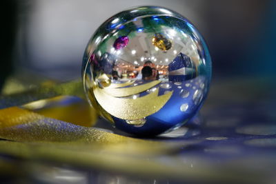 Close-up of crystal ball on table