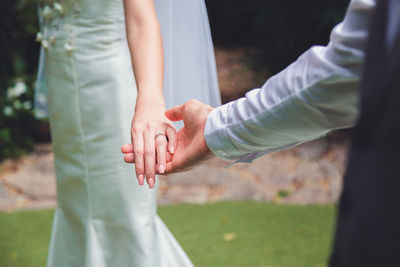 Bouquet in the hands of the groom. to make a happy wedding gift to a young bride.