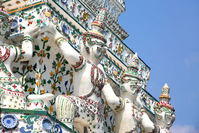 Low angle view of sculptures against sky