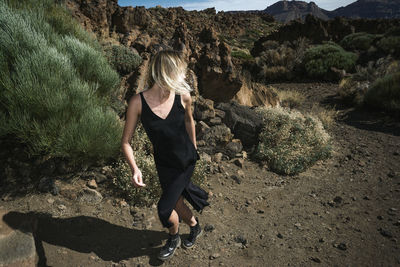 Woman standing on rock formation