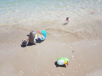 High angle view of toys on beach