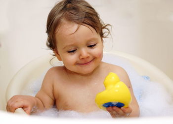 Portrait of baby boy in bathroom