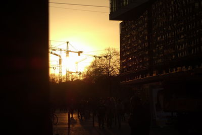 Buildings in city at sunset