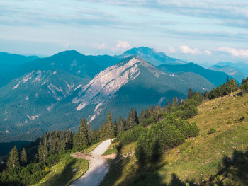 Scenic view of mountains against blue sky