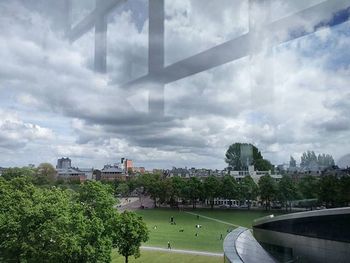 City skyline against cloudy sky