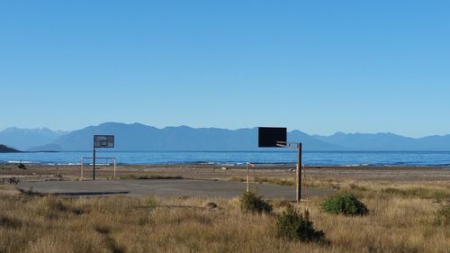 Scenic view of mountains against clear blue sky