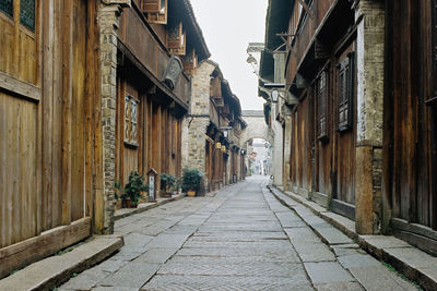 Street amidst buildings against sky