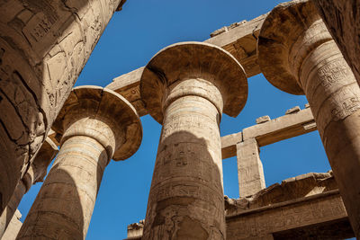 Different columns with hieroglyphs in karnak temple. karnak temple is the largest complex in egypt.