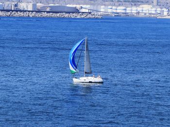 High angle view of sailboat sailing in sea