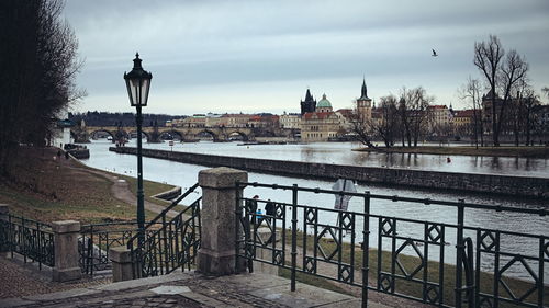 View of bridge over river against cloudy sky