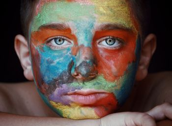 Close-up portrait of boy with face paint