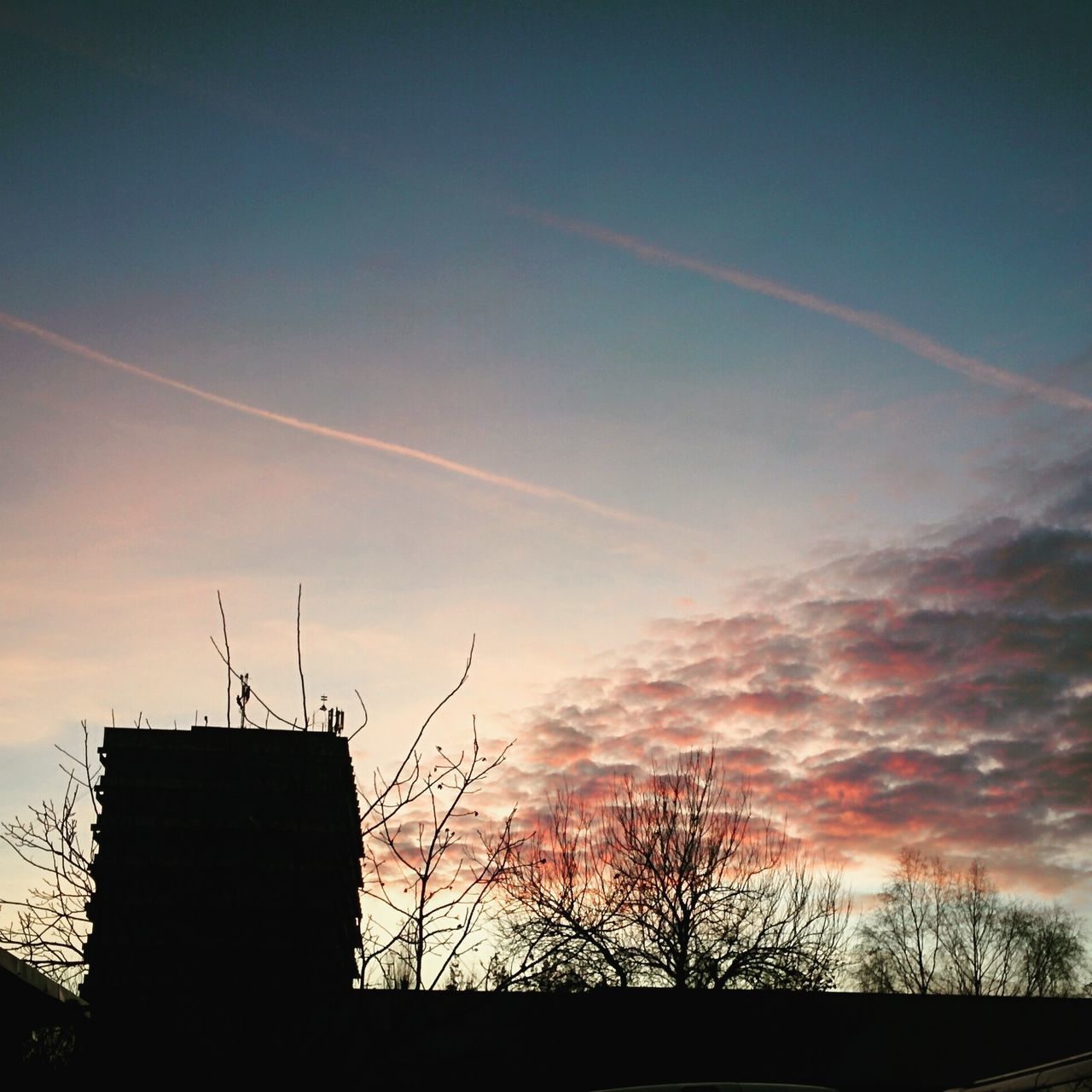 LOW ANGLE VIEW OF SILHOUETTE TELEPHONE POLE AGAINST SKY