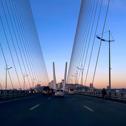 View of suspension bridge against sky during sunset