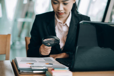 Mid adult man using mobile phone