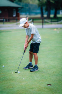 Full length of man playing with ball