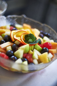 Close-up of fruits in plate on table