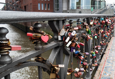 Padlocks on bridge in city