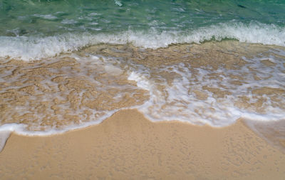 High angle view of surf on beach