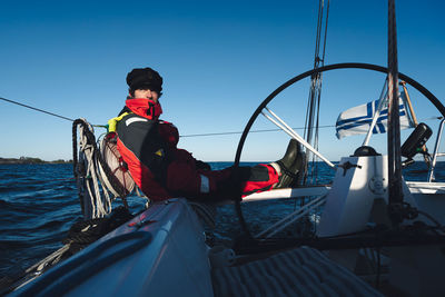 Low angle view of man sitting in boat