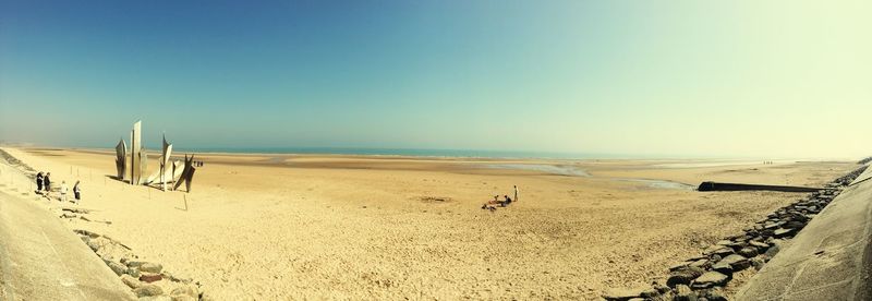 Scenic view of beach against clear sky