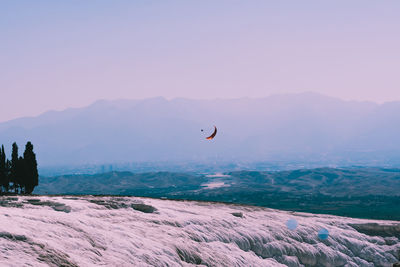 Scenic view of mountains against sky during sunset