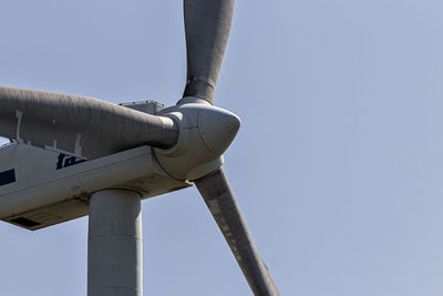 Low angle view of pipe against clear sky