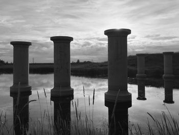 Built structure on landscape against sky
