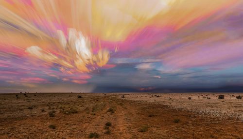 Scenic view of dramatic sky over land