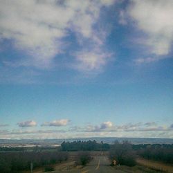 Scenic view of landscape against cloudy sky