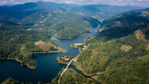 High angle view of river amidst mountains