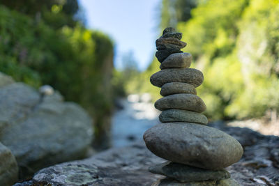 Pebbles stacked on rock