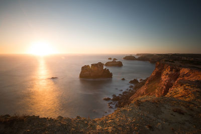 Scenic view of sea against sky during sunset