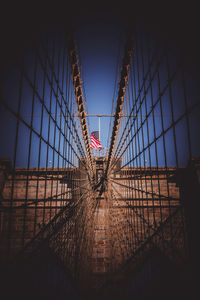 Low angle view of bridge against buildings