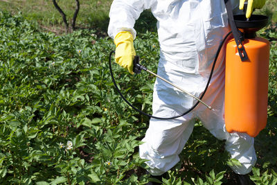 Midsection of crop sprayer at farm