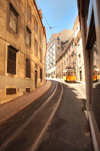 Road in city against clear sky