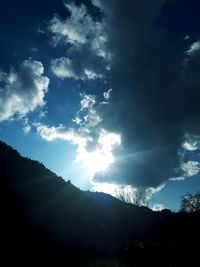 Low angle view of silhouette mountain against sky