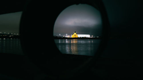 Silhouette of people on boat in river