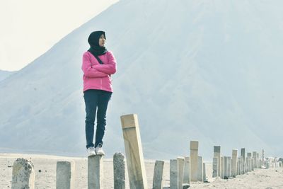 Full length of woman standing against the sky