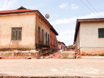 Street amidst buildings against sky in city