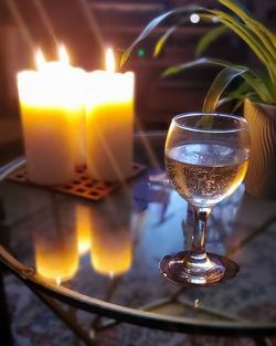 Close-up of wine glasses on table